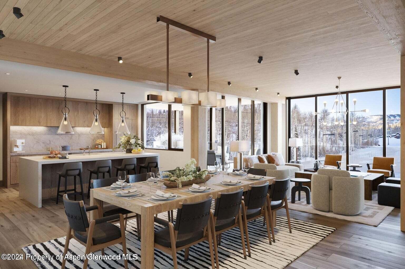 a large kitchen with a table and chairs