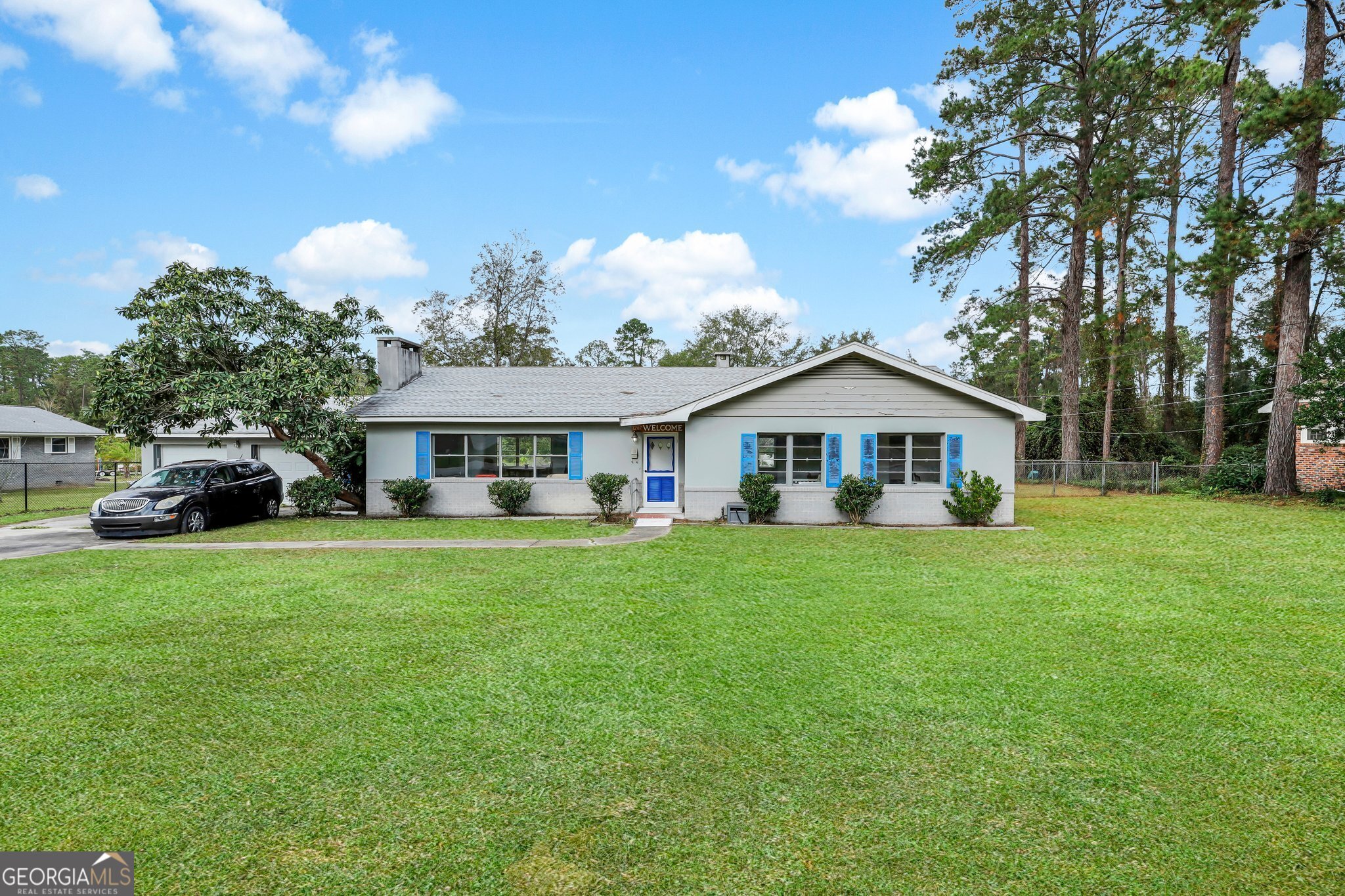 a front view of a house with garden