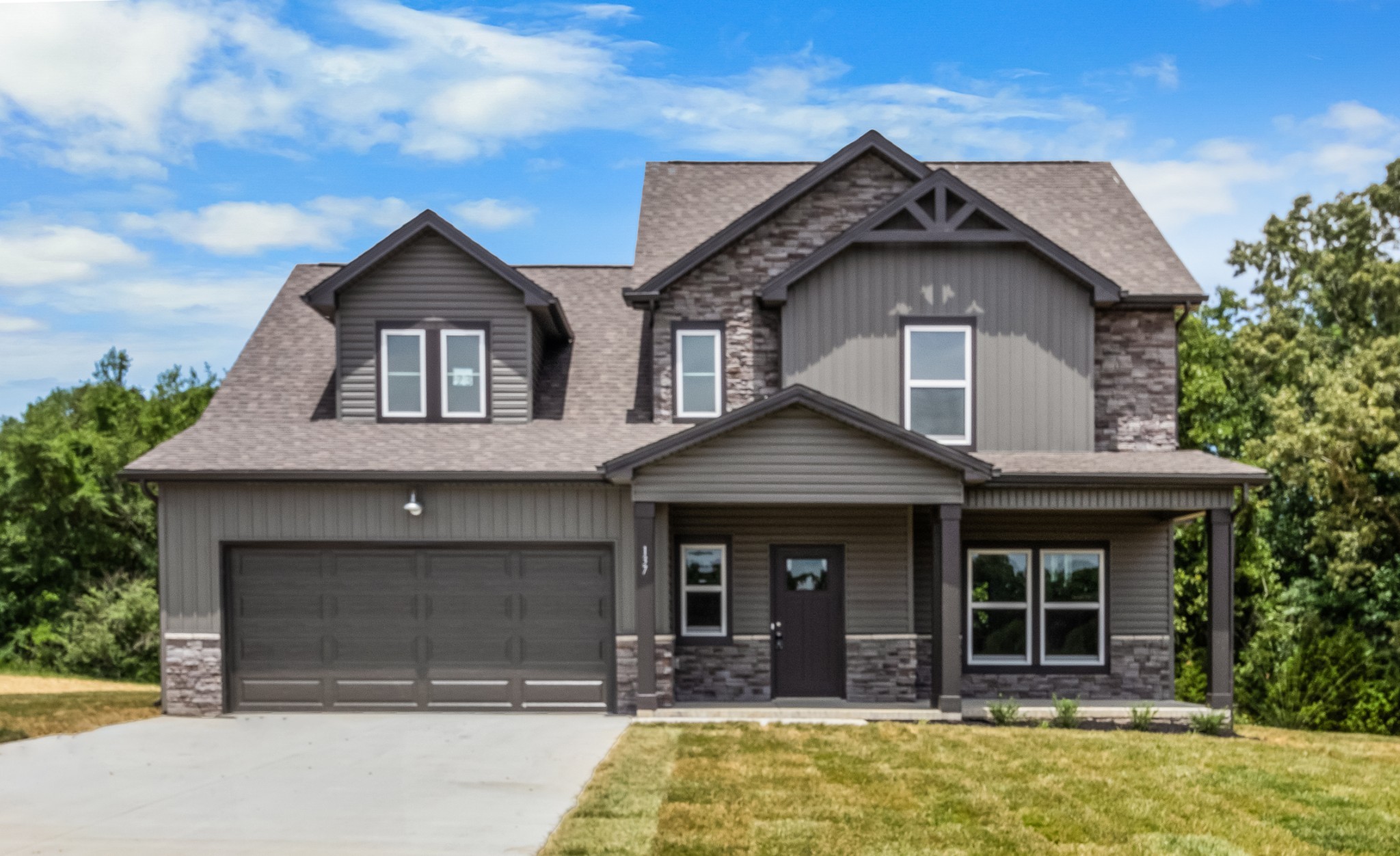 a front view of a house with a yard