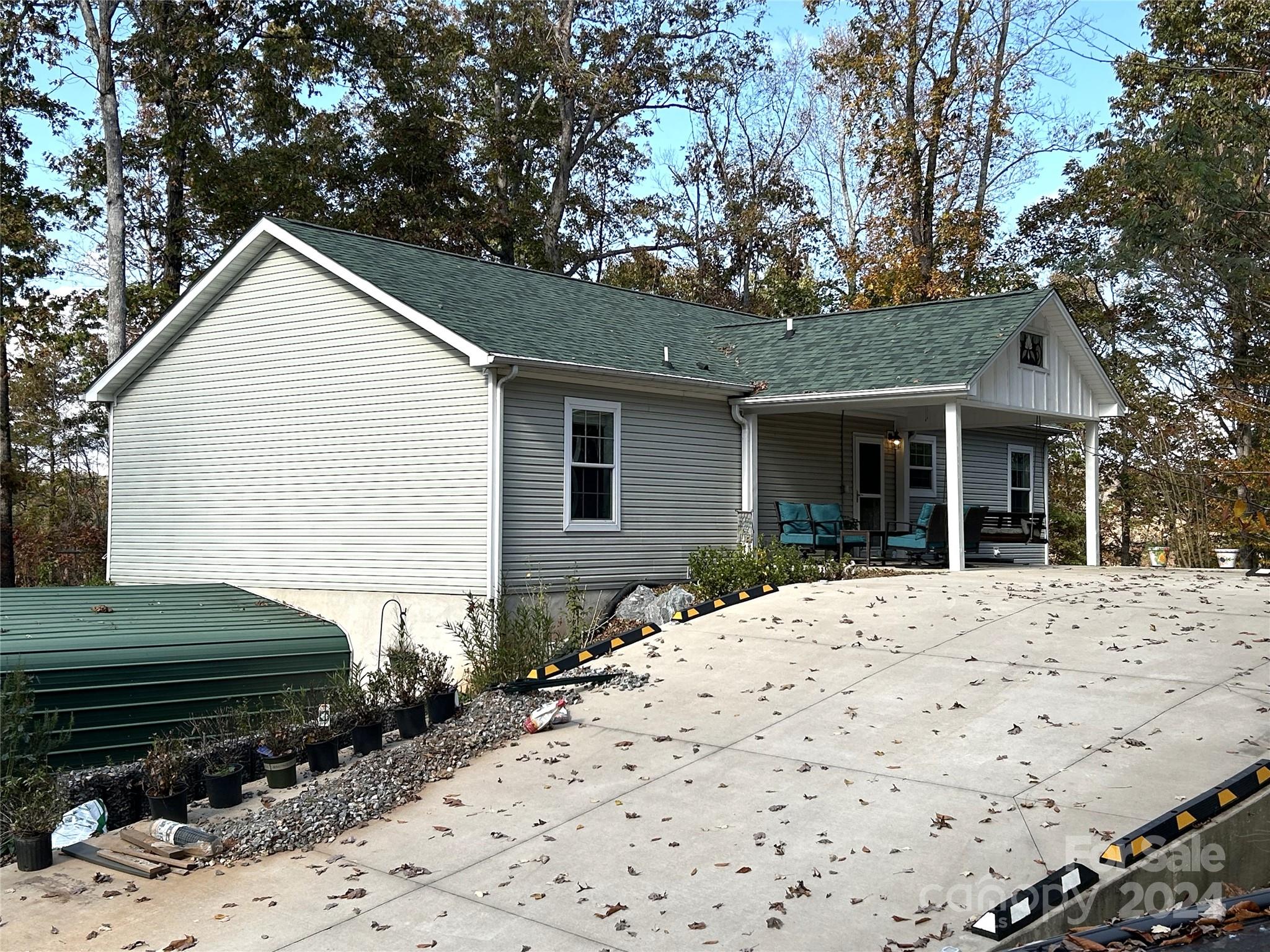 a front view of a house with a yard covered in snow