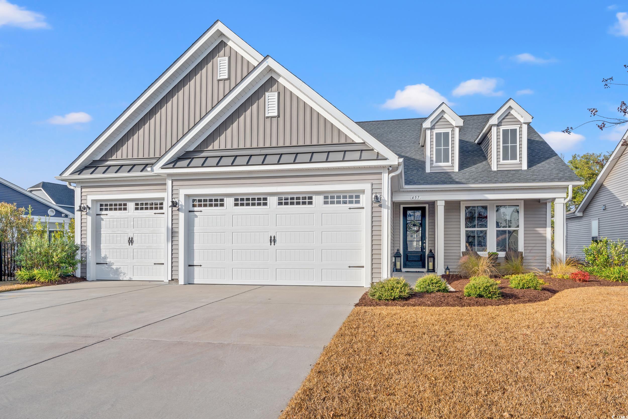 View of front facade featuring a garage