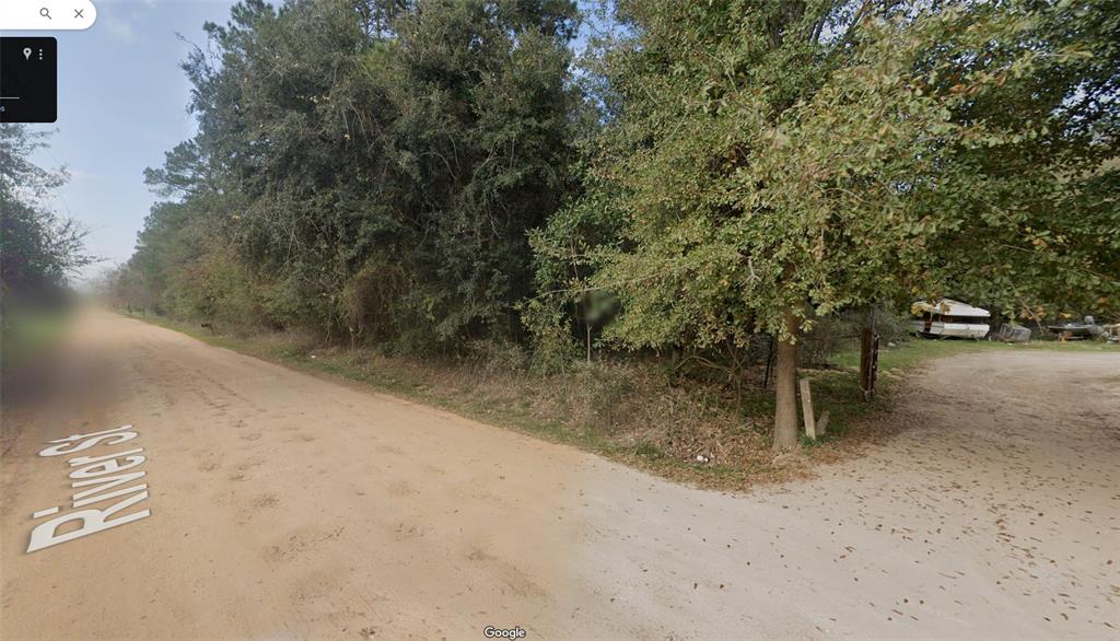 a view of a road with trees in front of it