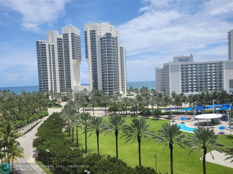 a view of a city with tall buildings