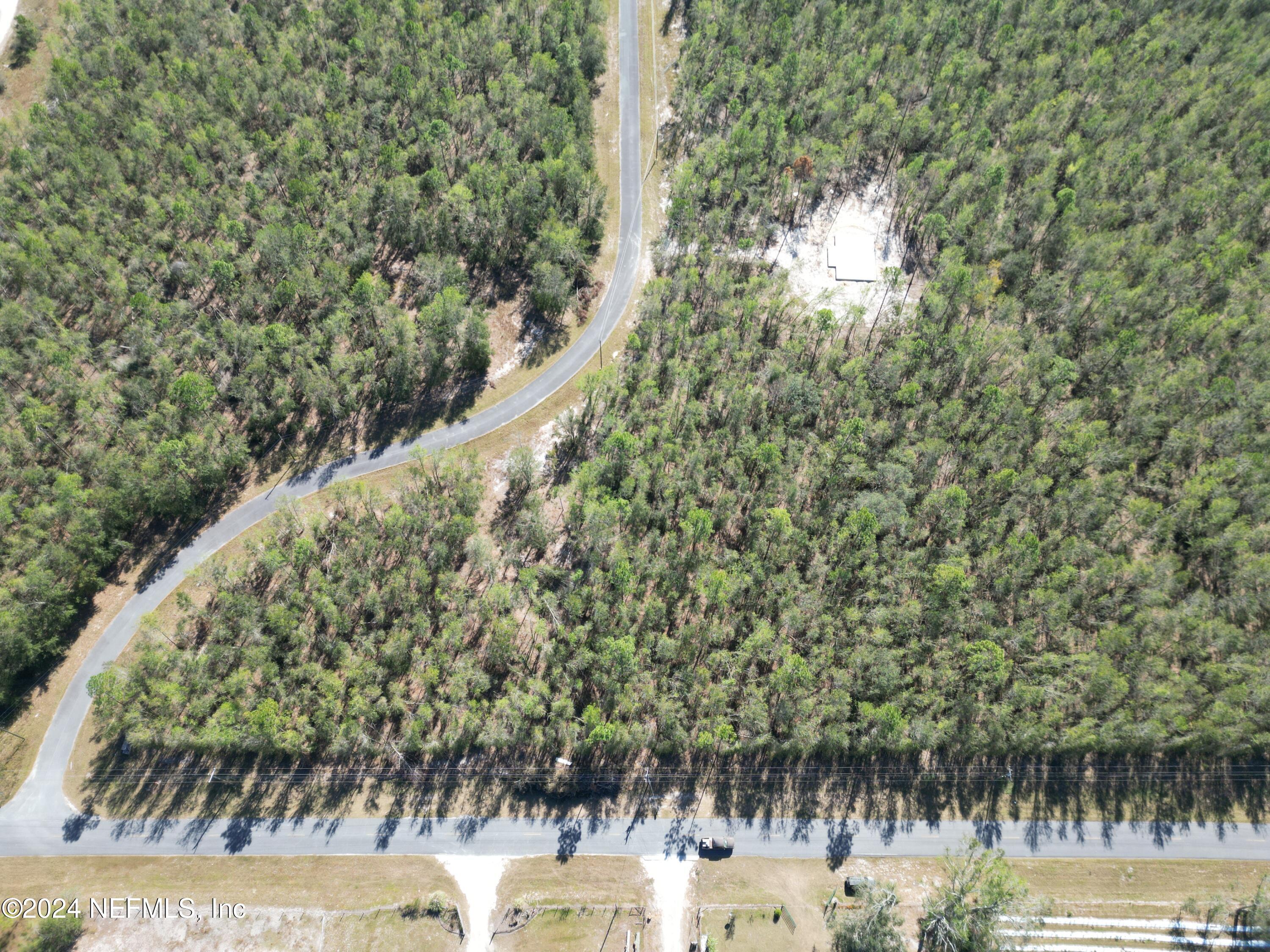 a view of a lake with a yard