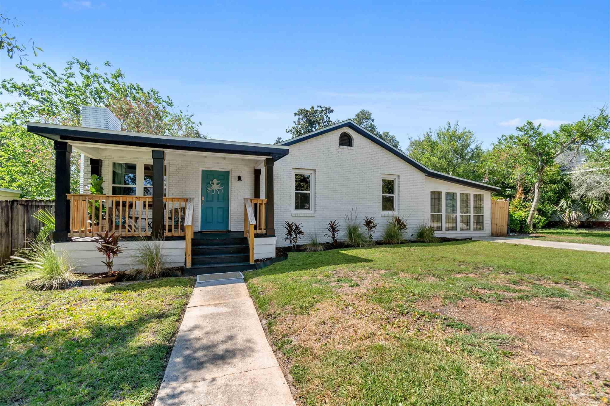 front view of a house with a yard