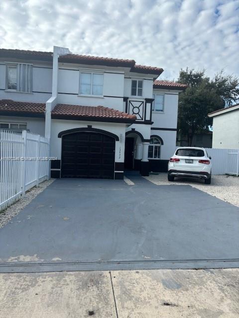 a car parked in front of a house