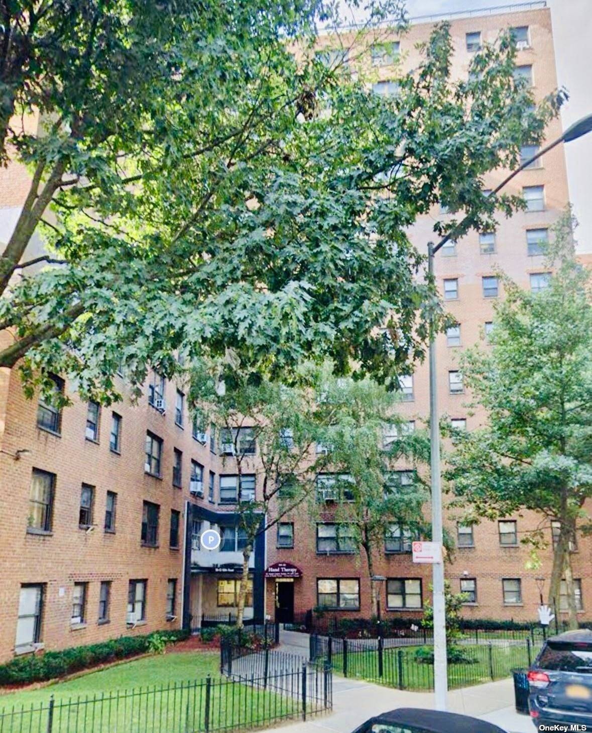 a view of a building with a yard