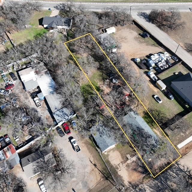 an aerial view of a residential houses with outdoor space