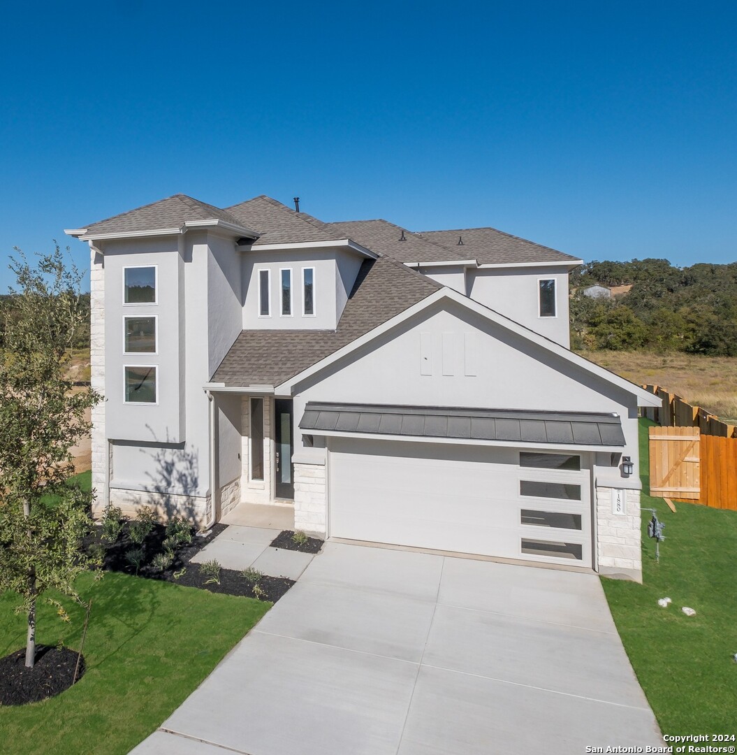 a front view of a house with a yard