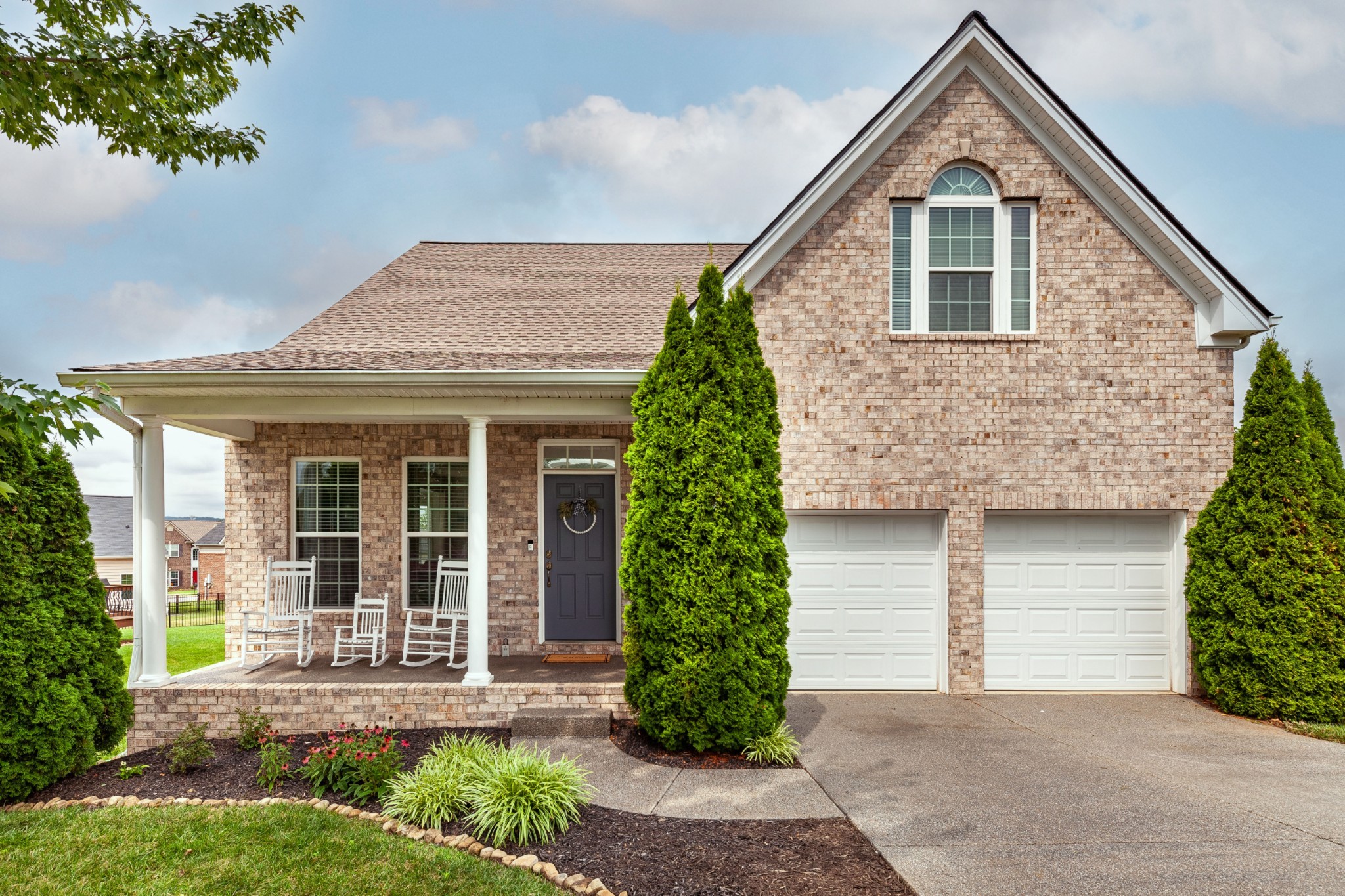 front view of a house with a yard