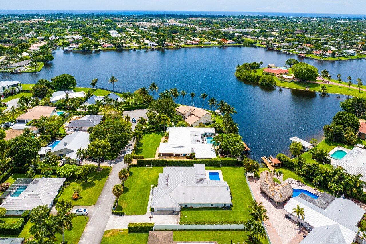 an aerial view of lake houses residential houses with outdoor space and swimming pool