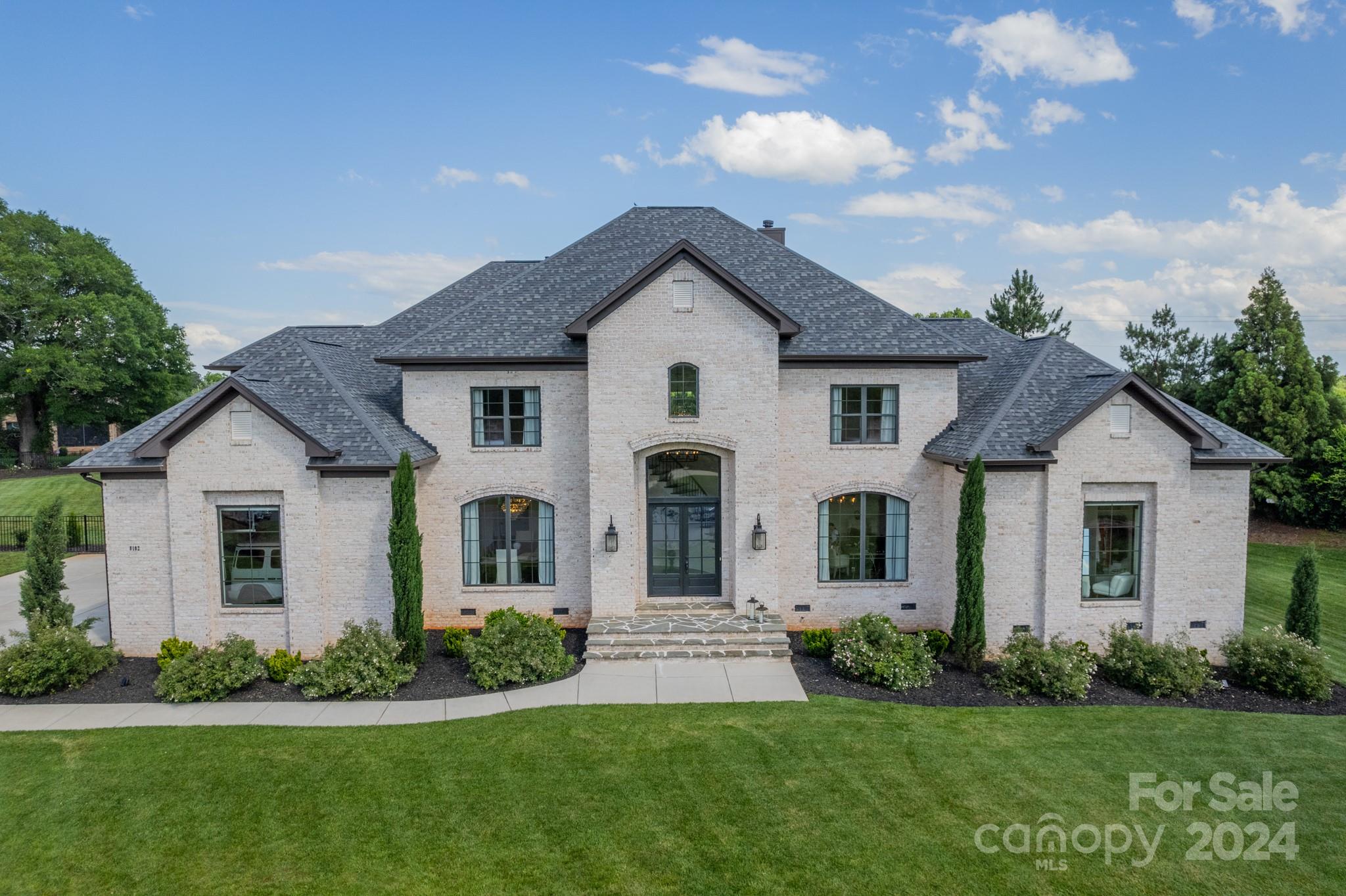 front view of a house with a yard