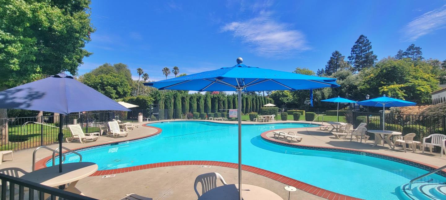 a view of swimming pool with outdoor seating