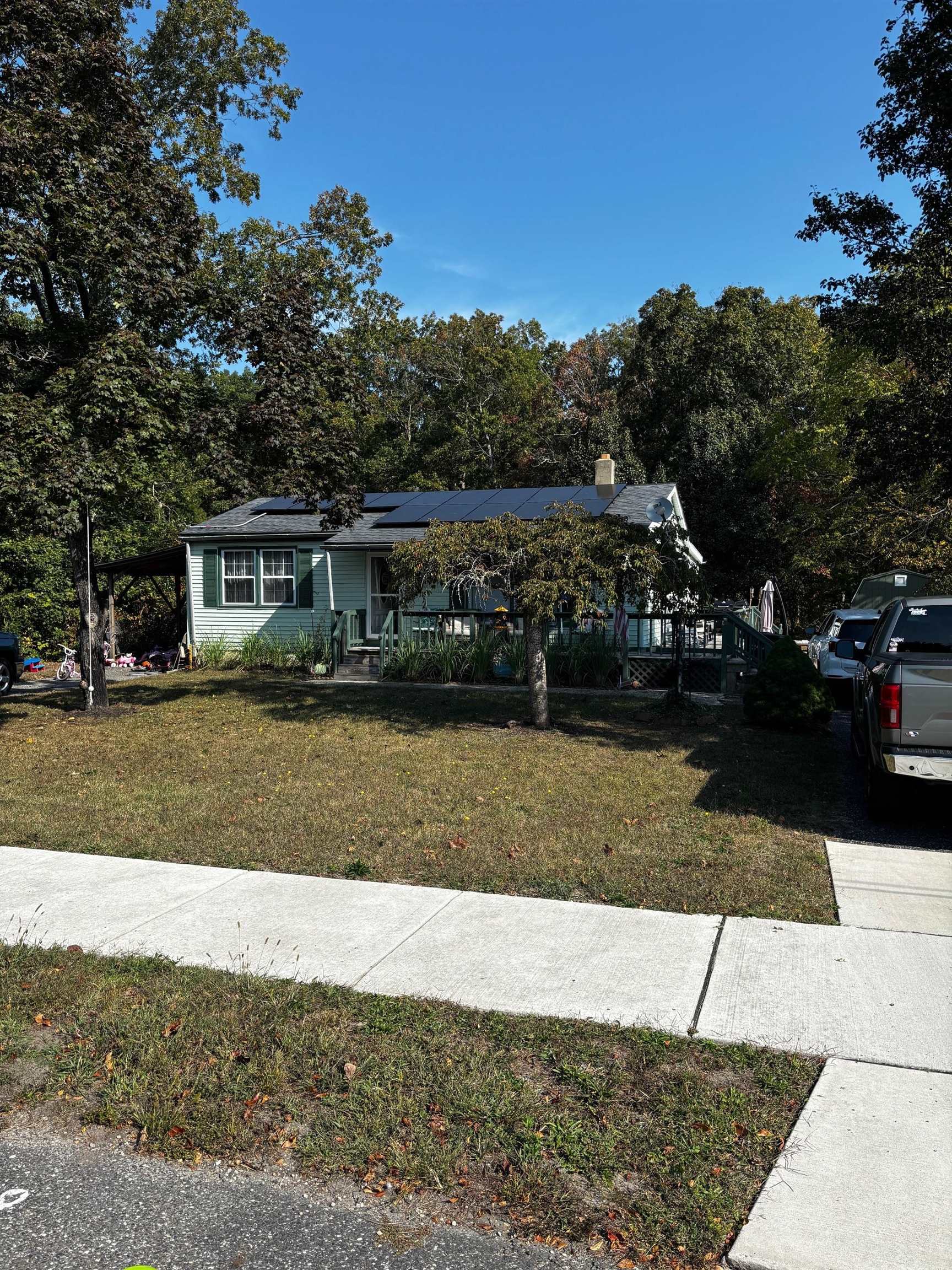 a view of house with a yard