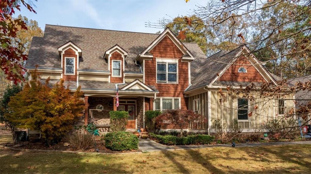 a front view of a house with a yard