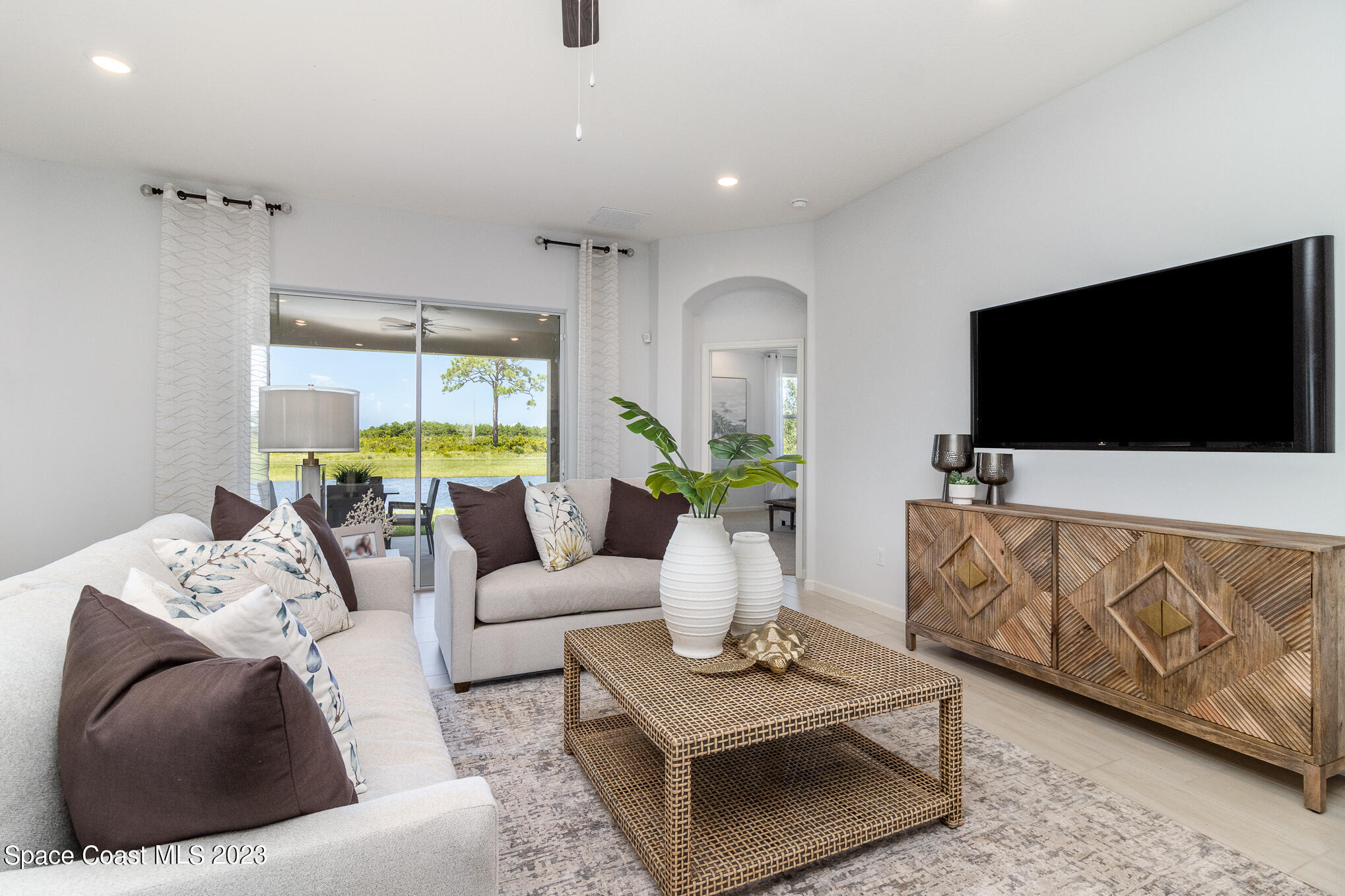 a living room with furniture and a flat screen tv