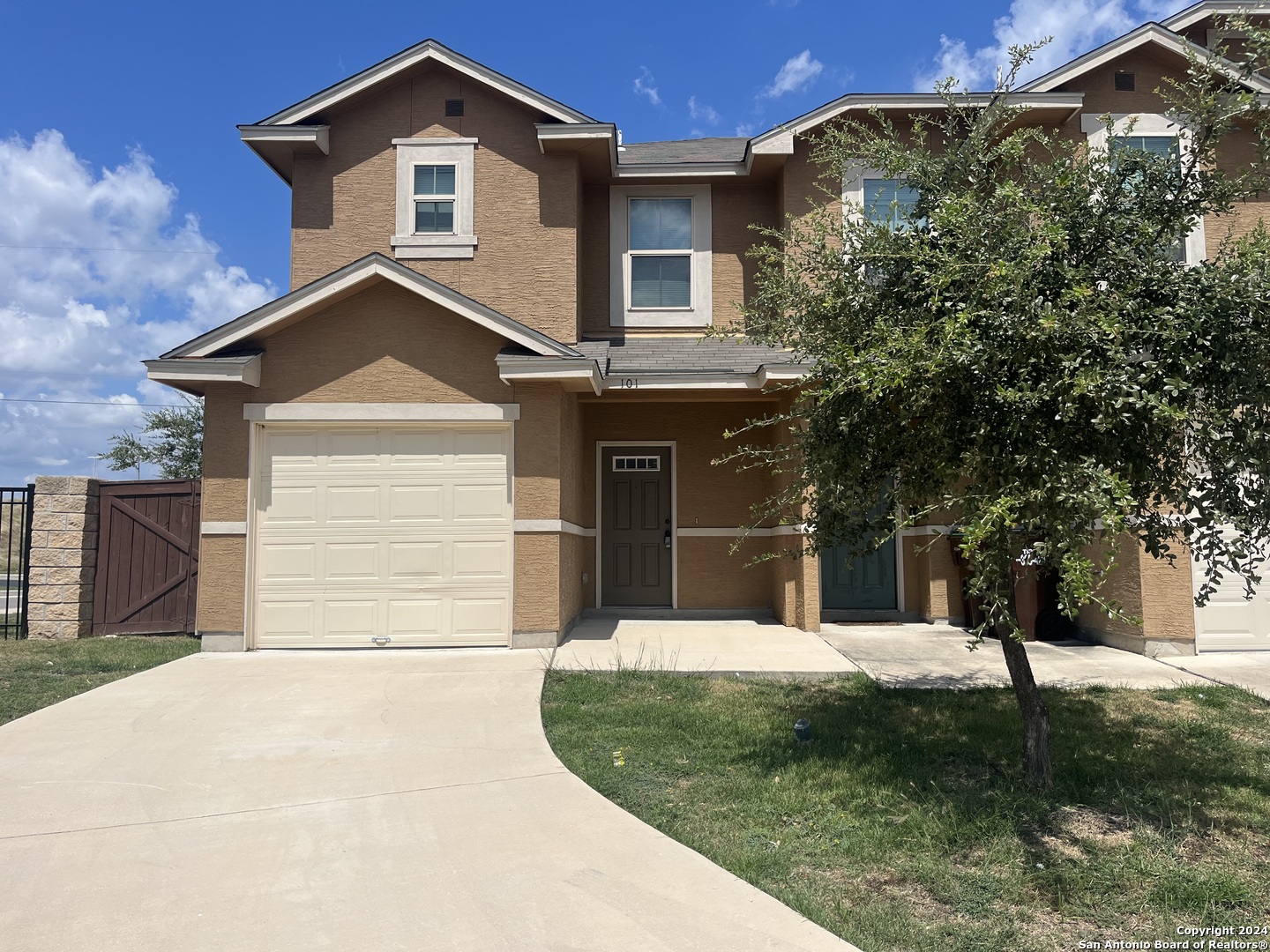 a front view of a house with a yard