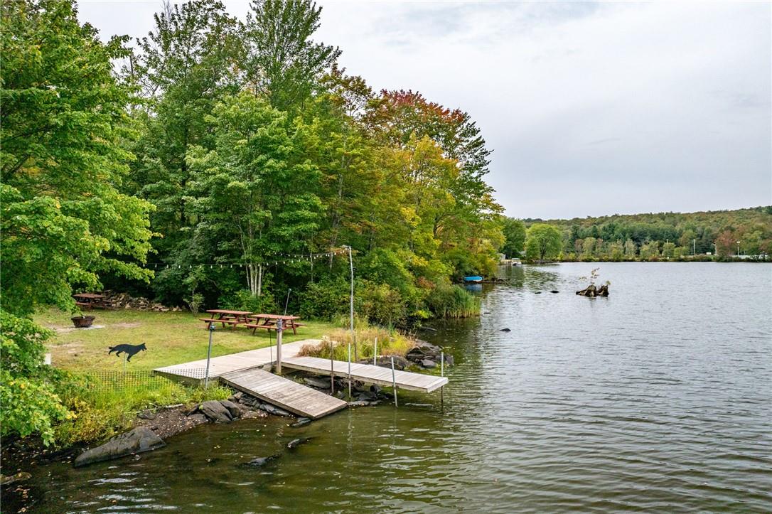 Dock area featuring a water view