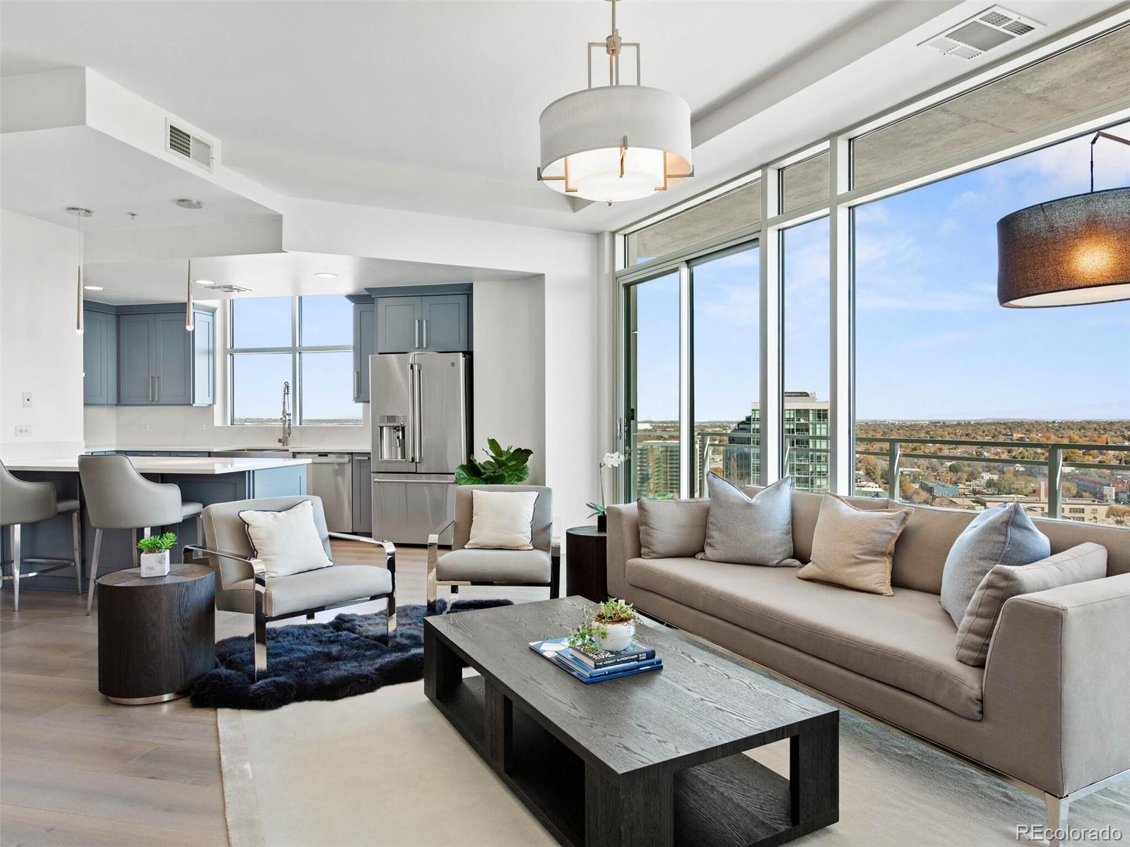 a living room with furniture potted plant and a chandelier