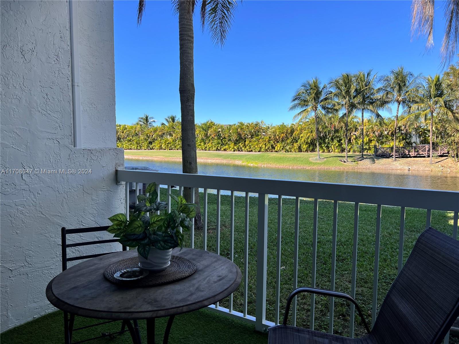 a view of a chairs and table in patio