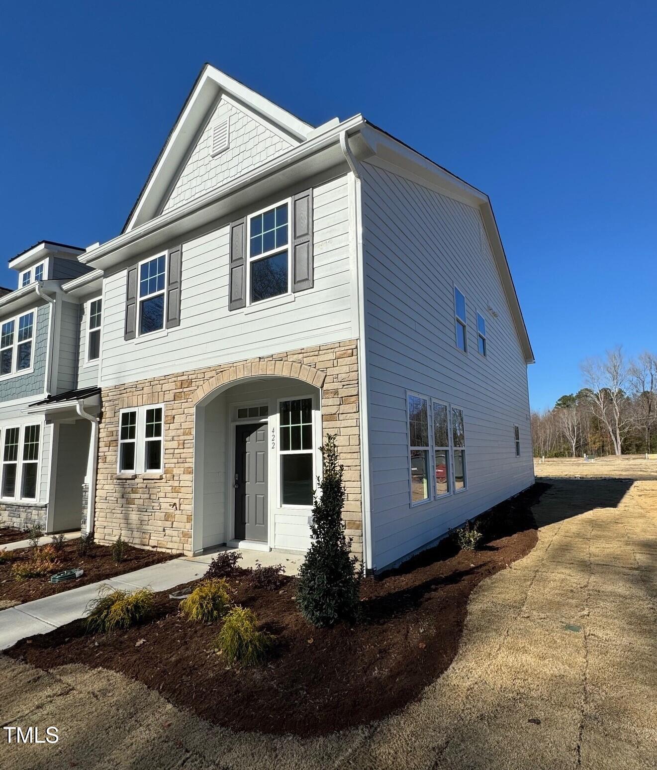 a front view of a house with yard