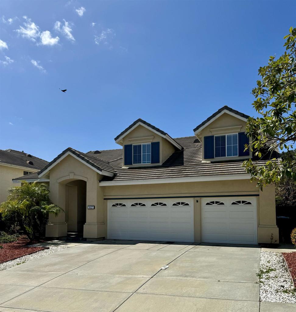 a front view of a house with yard