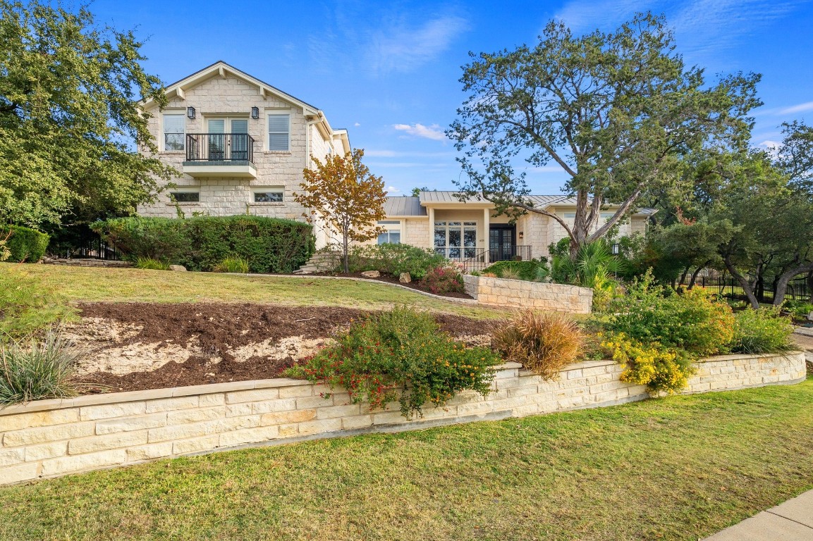 a front view of a house with garden