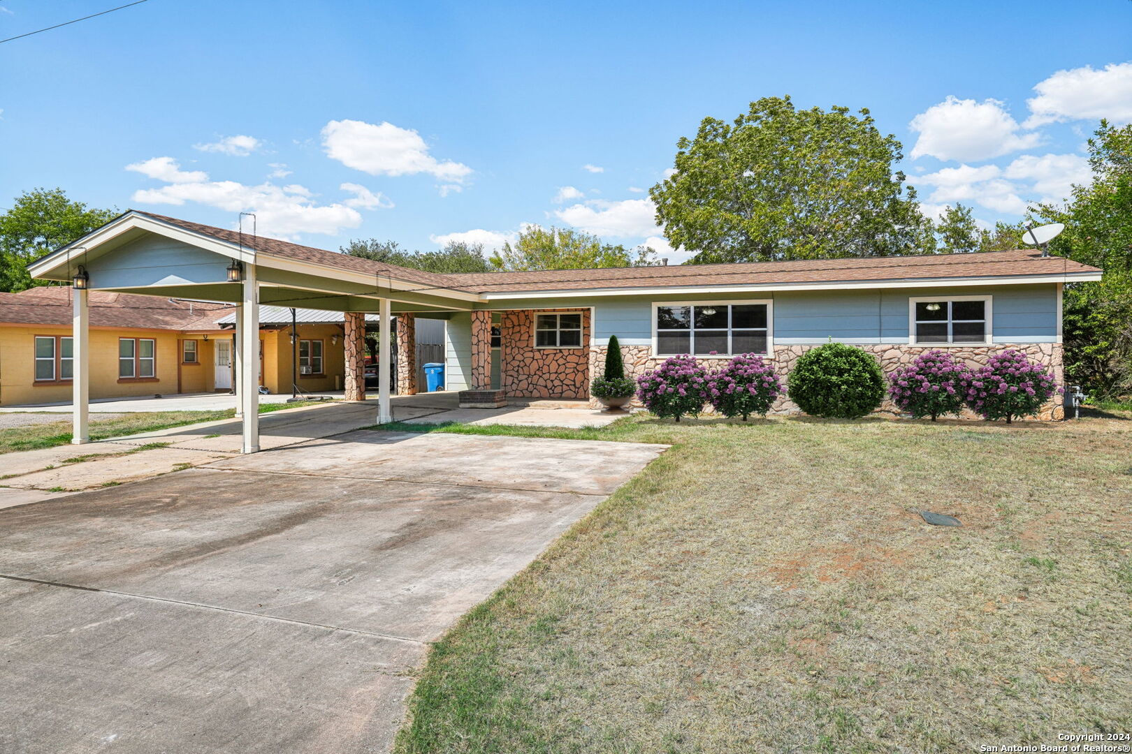 front view of a house with a yard