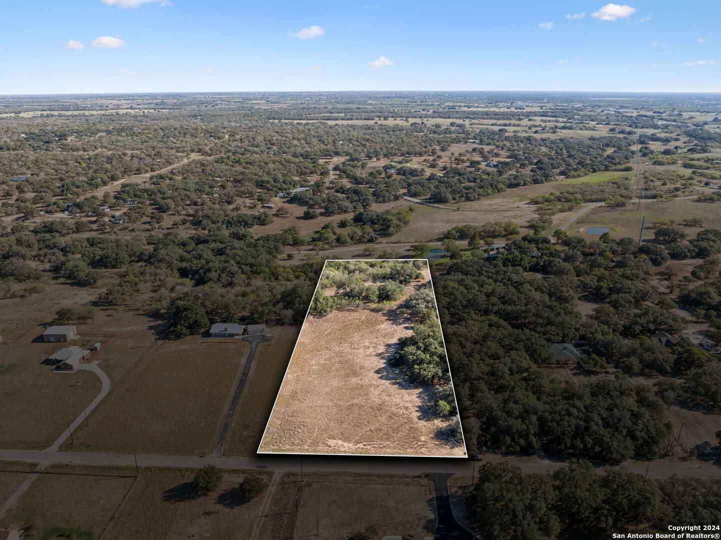 an aerial view of residential house with outdoor space