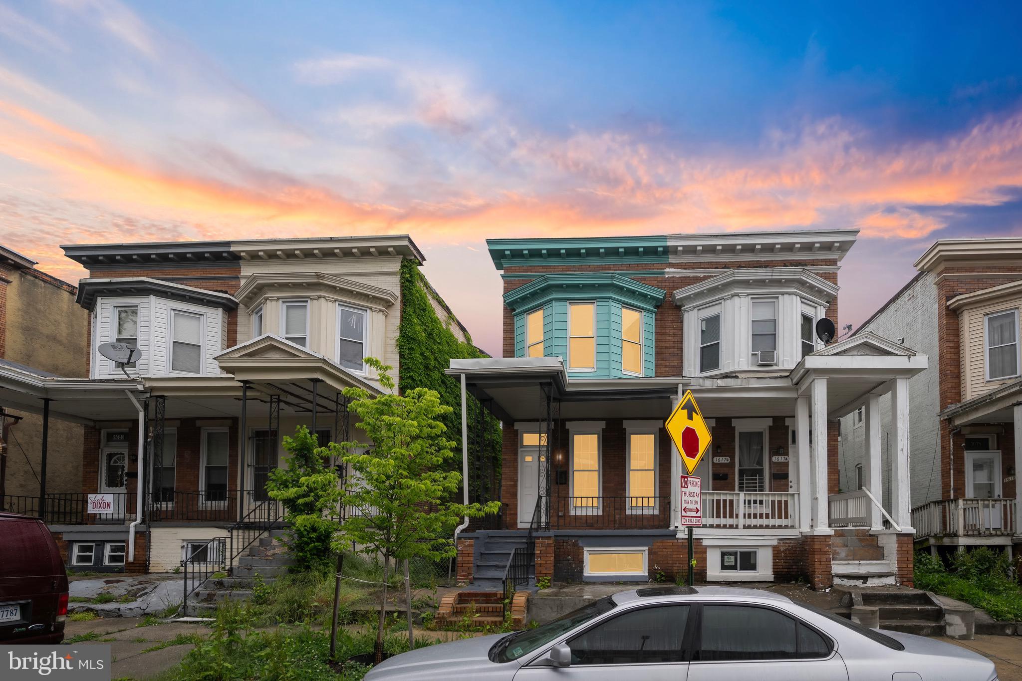 a front view of residential houses with yard