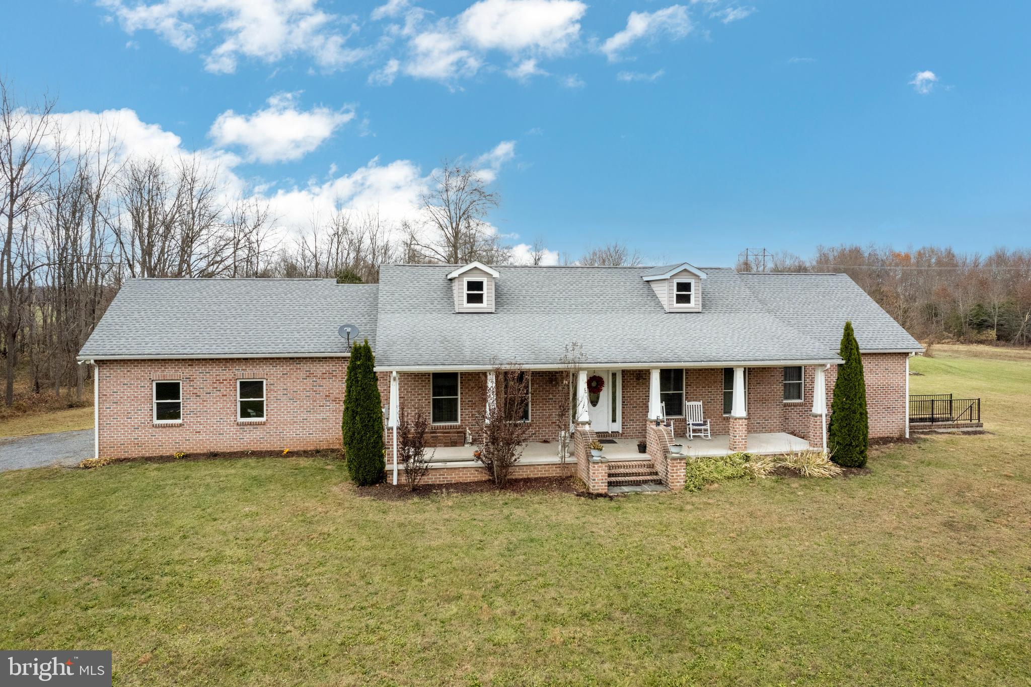 a front view of house with yard and seating area