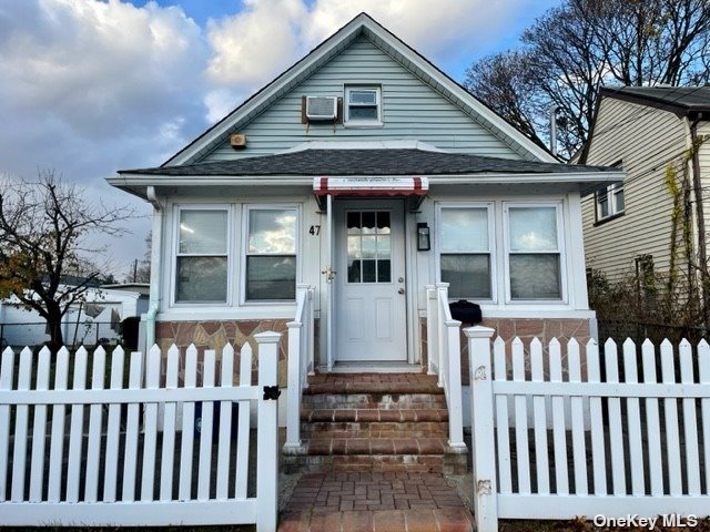 a front view of a house with a porch