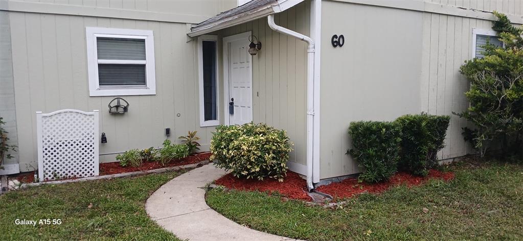 a front view of a house having yard