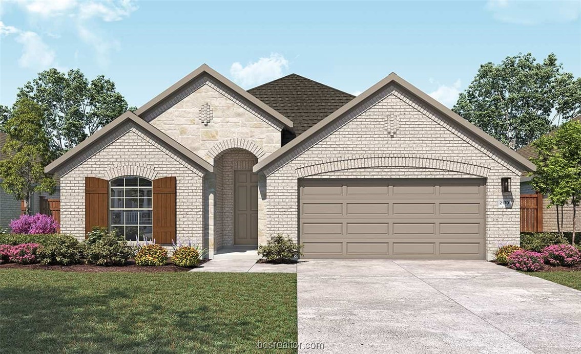 a view of a house with a yard and garage