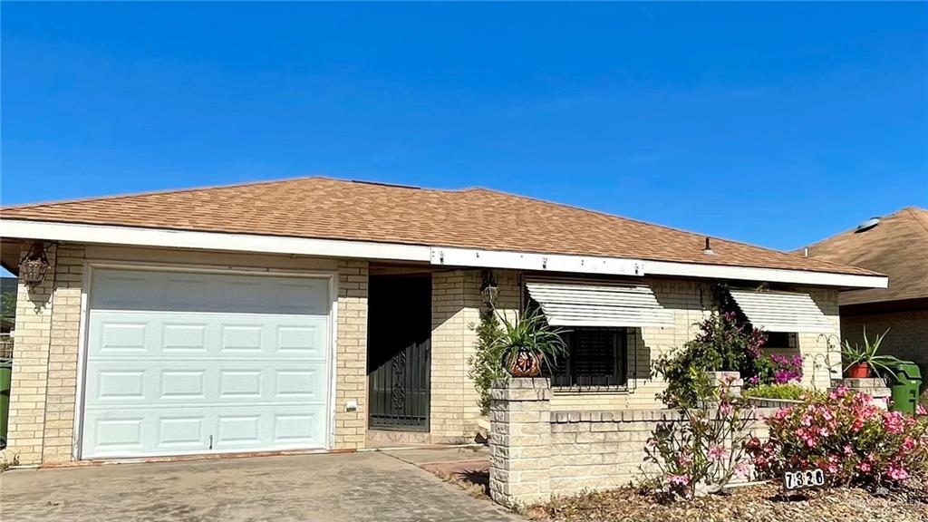 a front view of a house with a garage