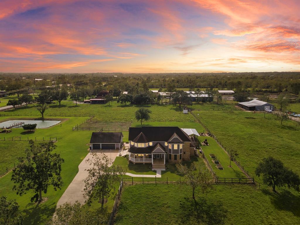 a view of a big yard with a house in the background