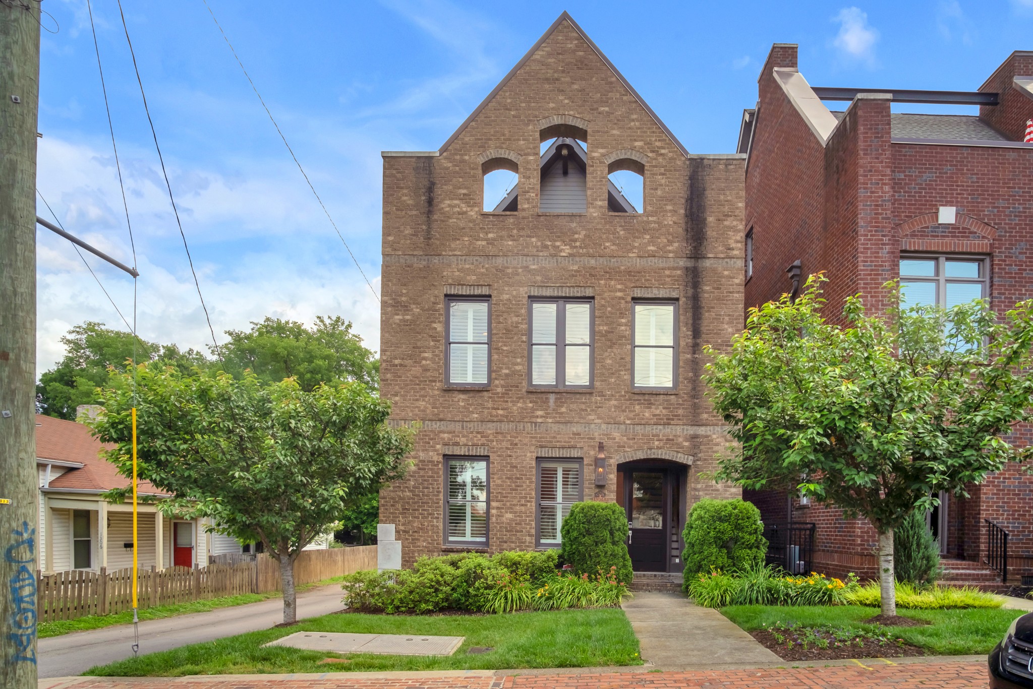 a front view of a house with garden