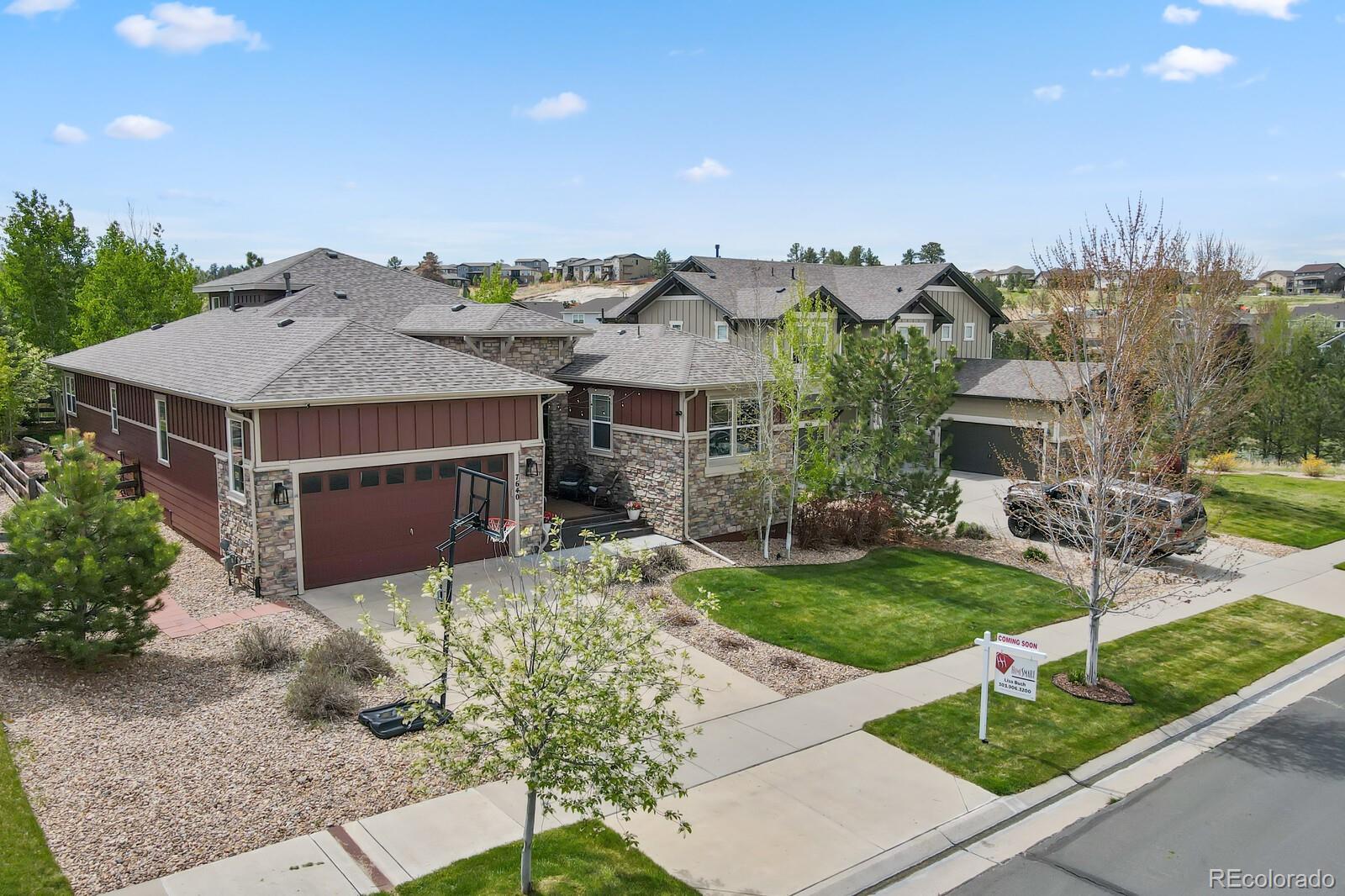 a aerial view of a house with a yard and plants