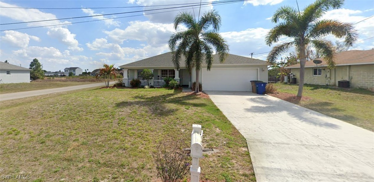 a view of a house with a yard