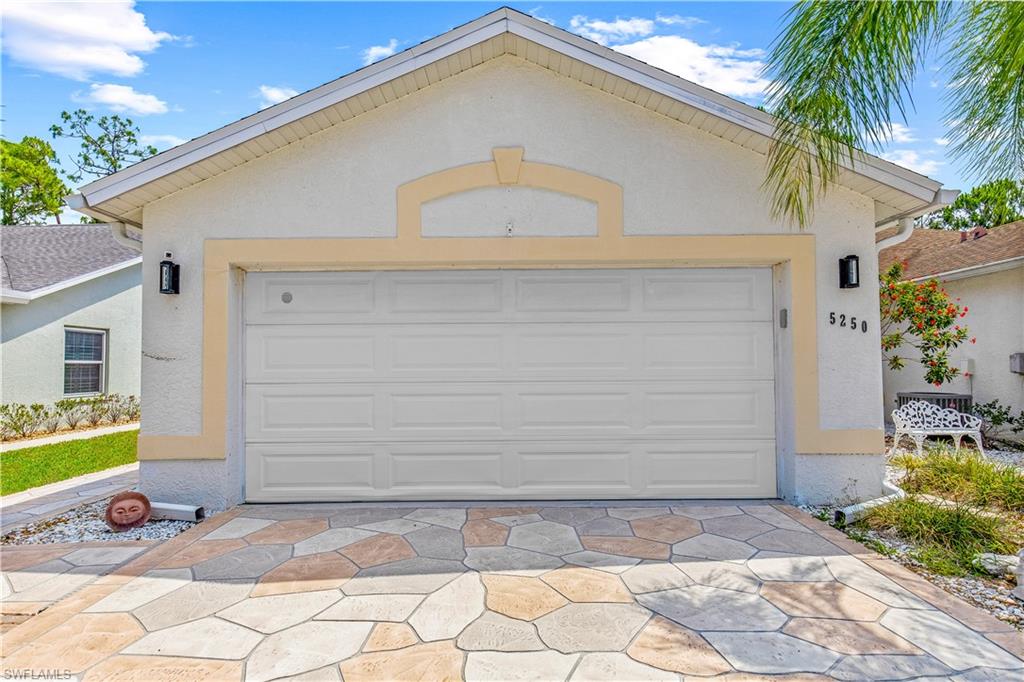 a front view of house along with yard and seating space