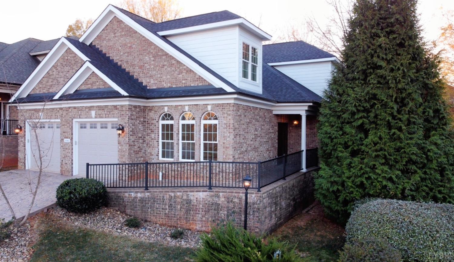 a front view of a house with plants