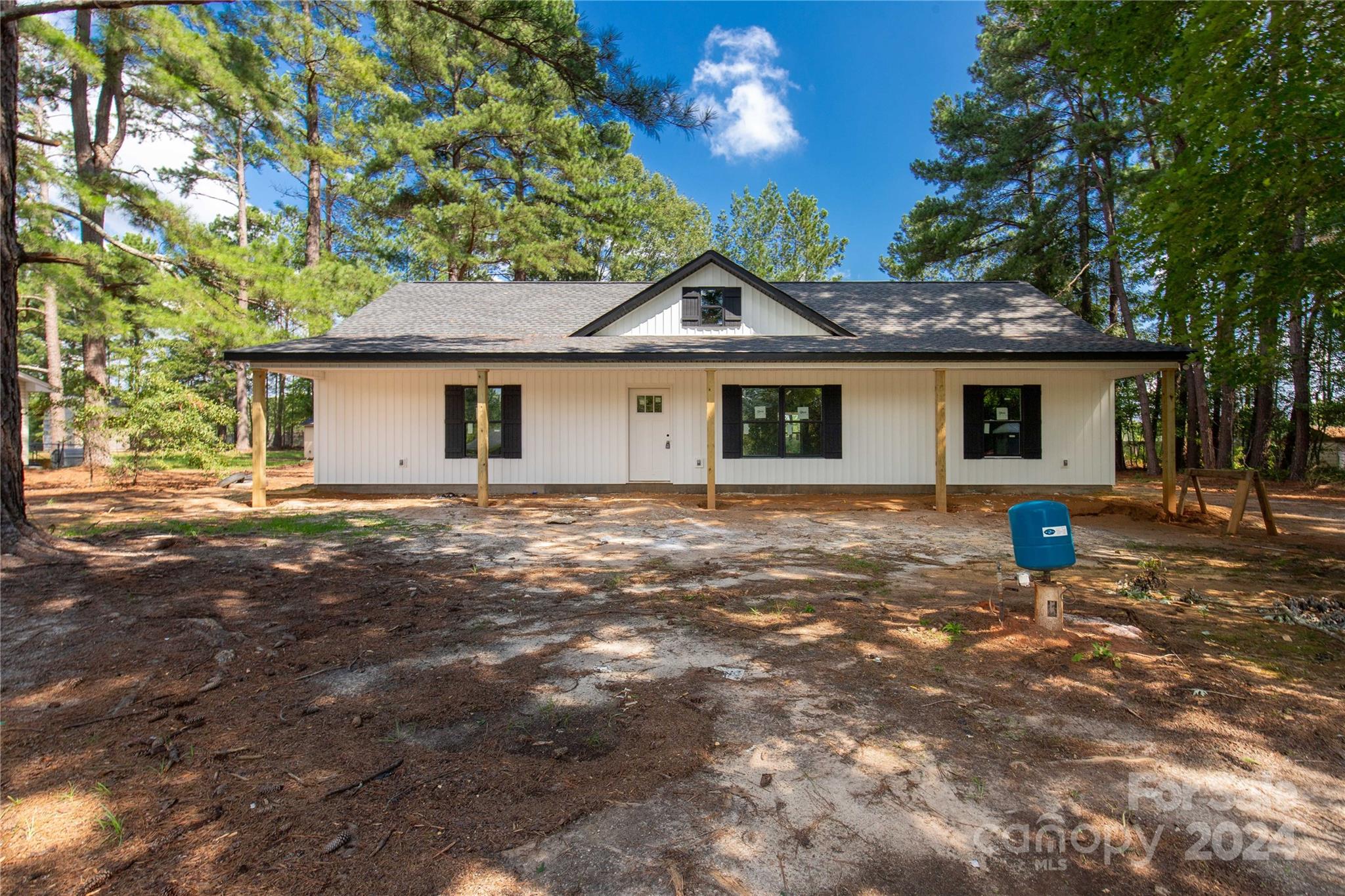 a house with trees in the background