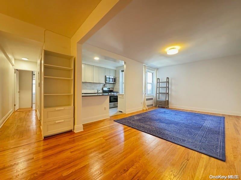 a view of kitchen and wooden floor