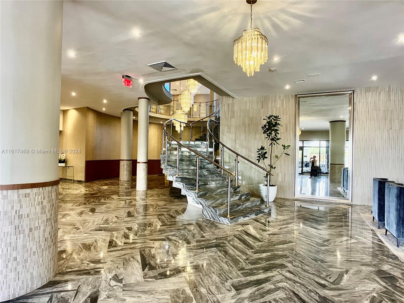 a view of a living room and a chandelier