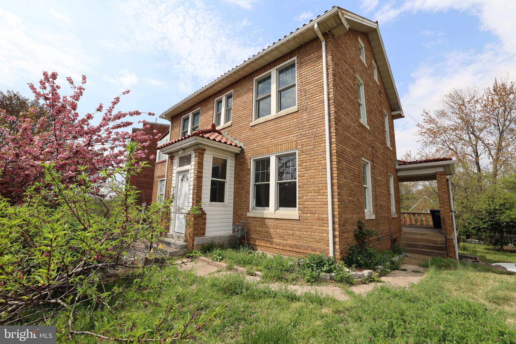 front view of a house with a yard