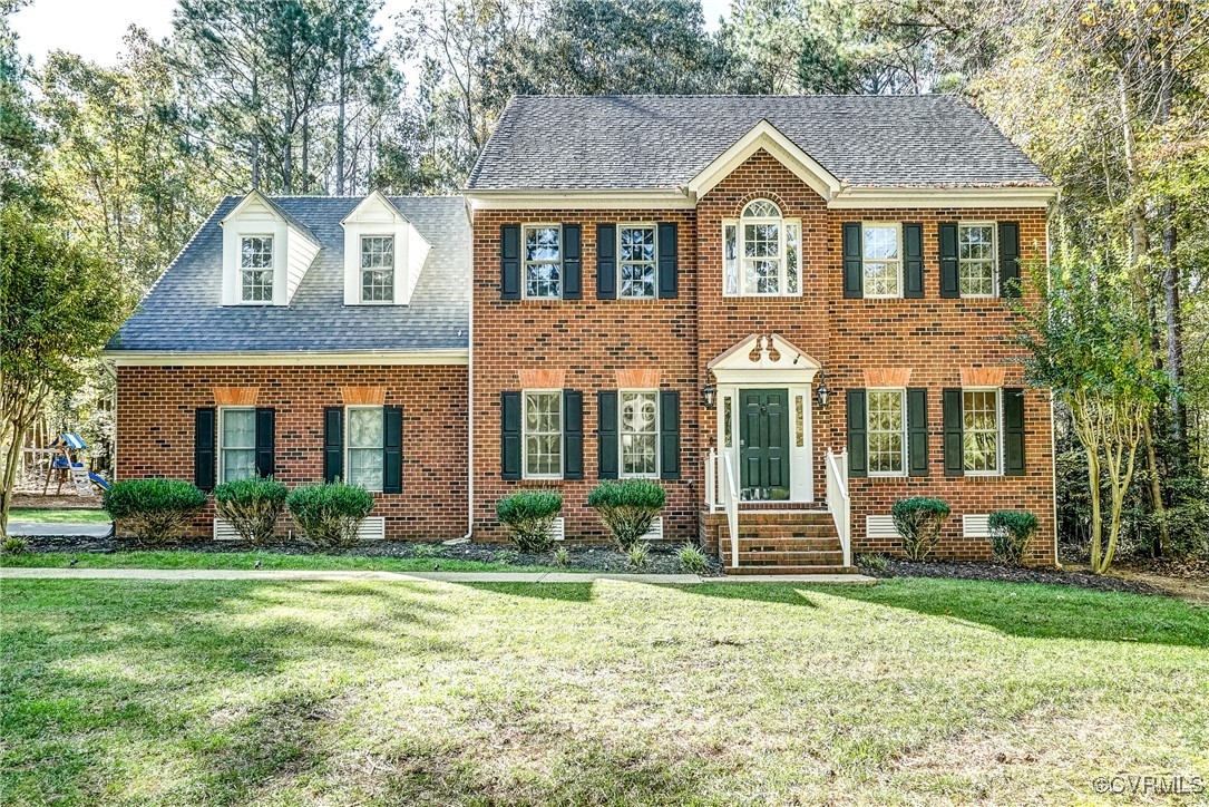 front view of a house with a yard