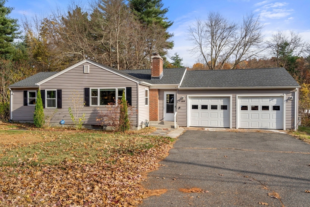 a front view of a house with yard