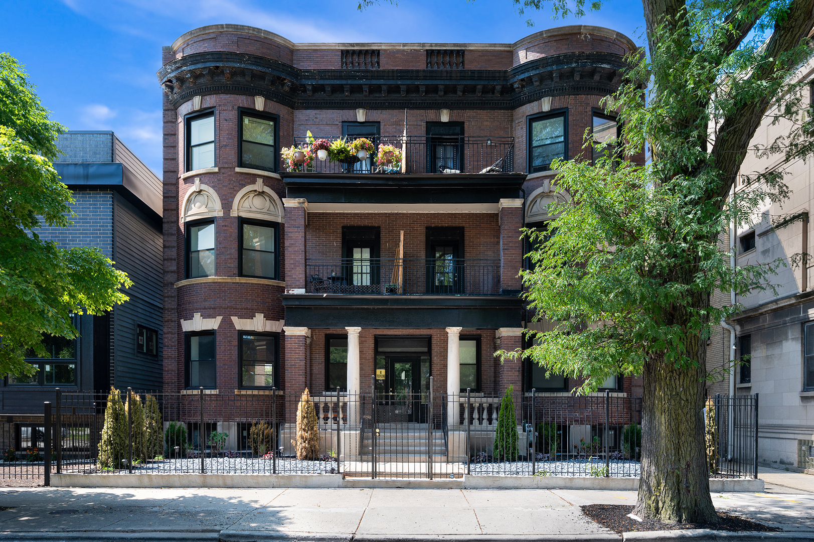 a front view of a house with a garden