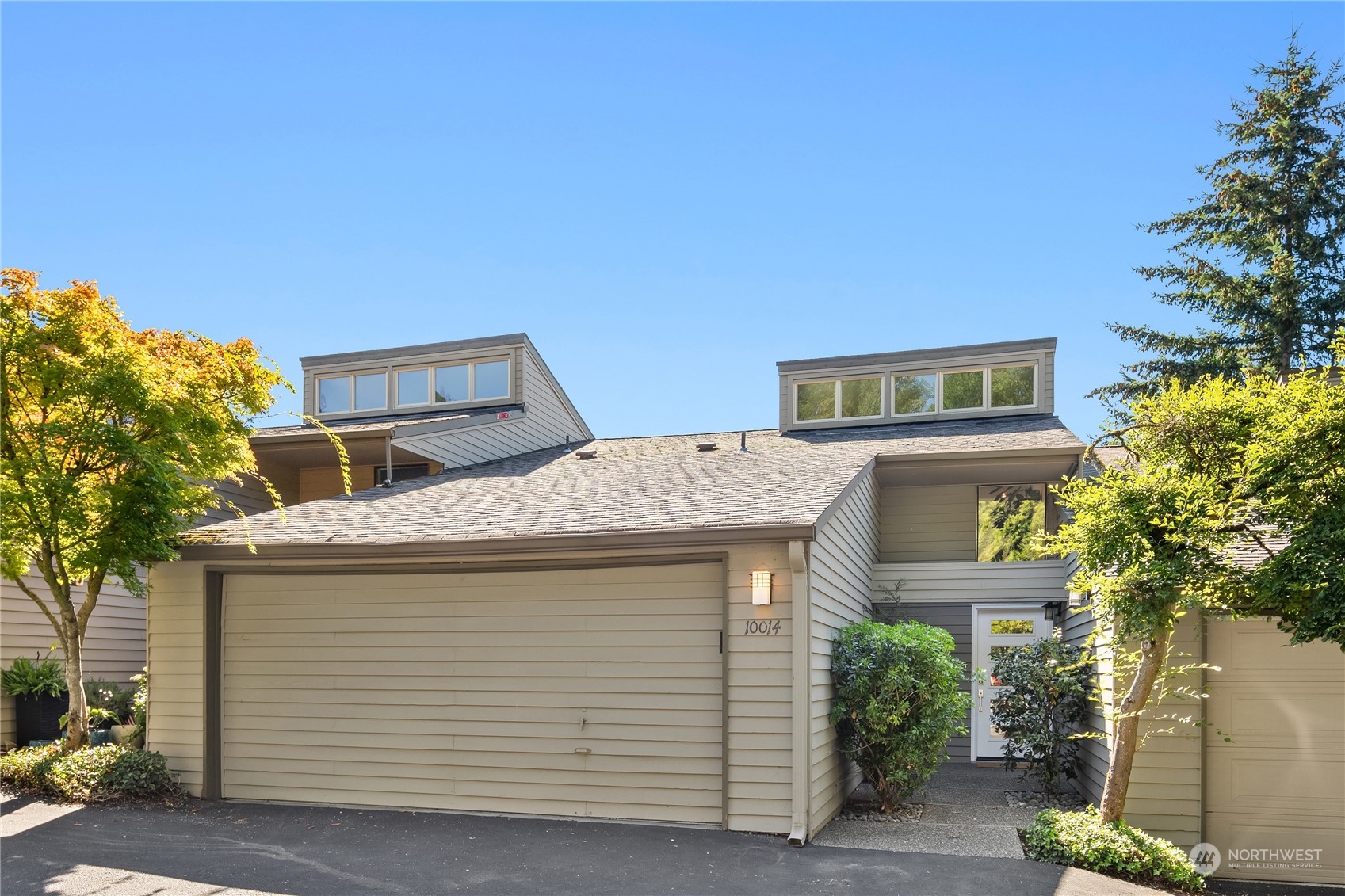 a front view of a house with a garage