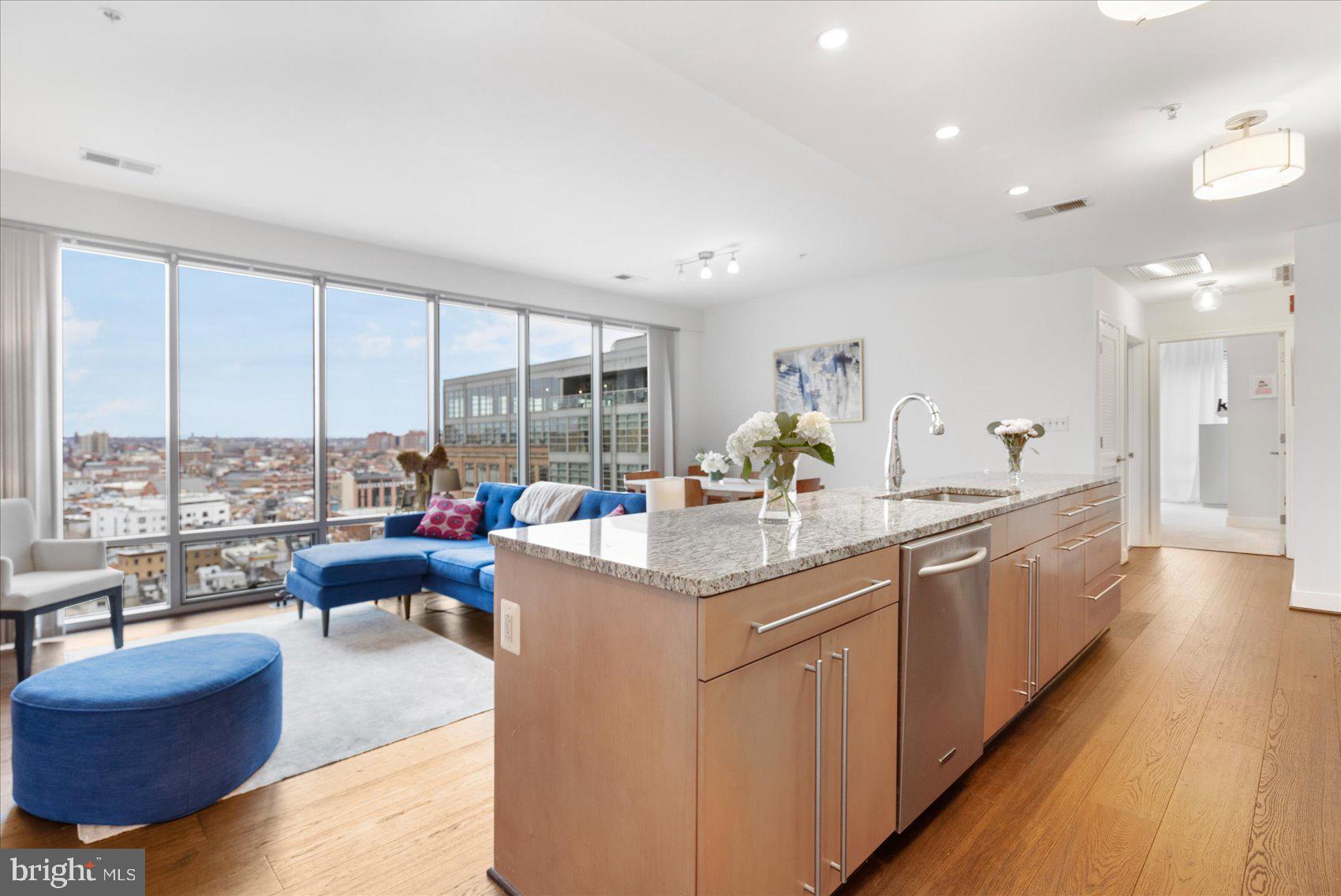 a open kitchen with stainless steel appliances granite countertop a lot of counter space and a sink